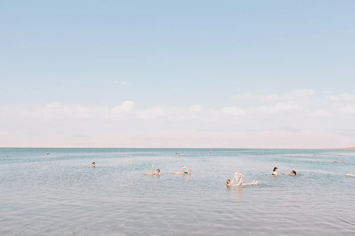 A swimmer floating on the Dead Sea, the moment every Dead Sea tour is built around